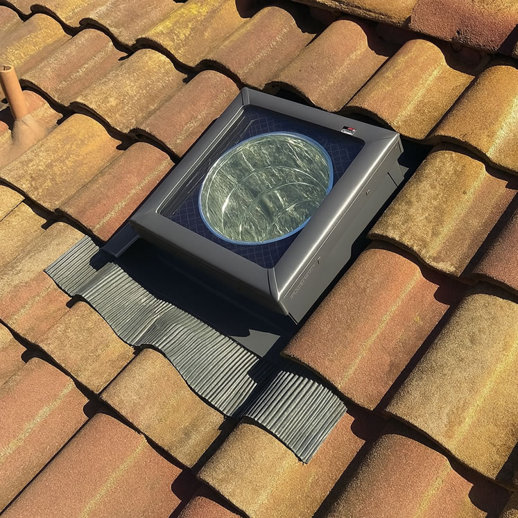 small sun tunnel on terracotta tile roof